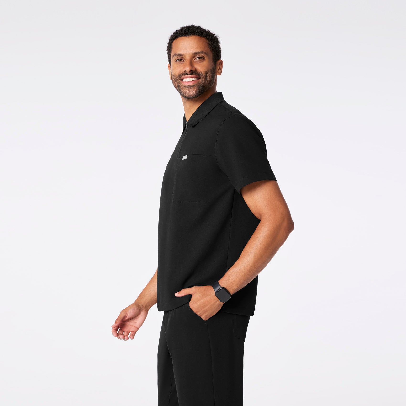 https://cdn.shopify.com/s/files/1/0139/8942/files/2025_Q4_10_BLACK_JASPER-POLO-SCRUB-TOP_GABE_1010.jpg?v=1762281336