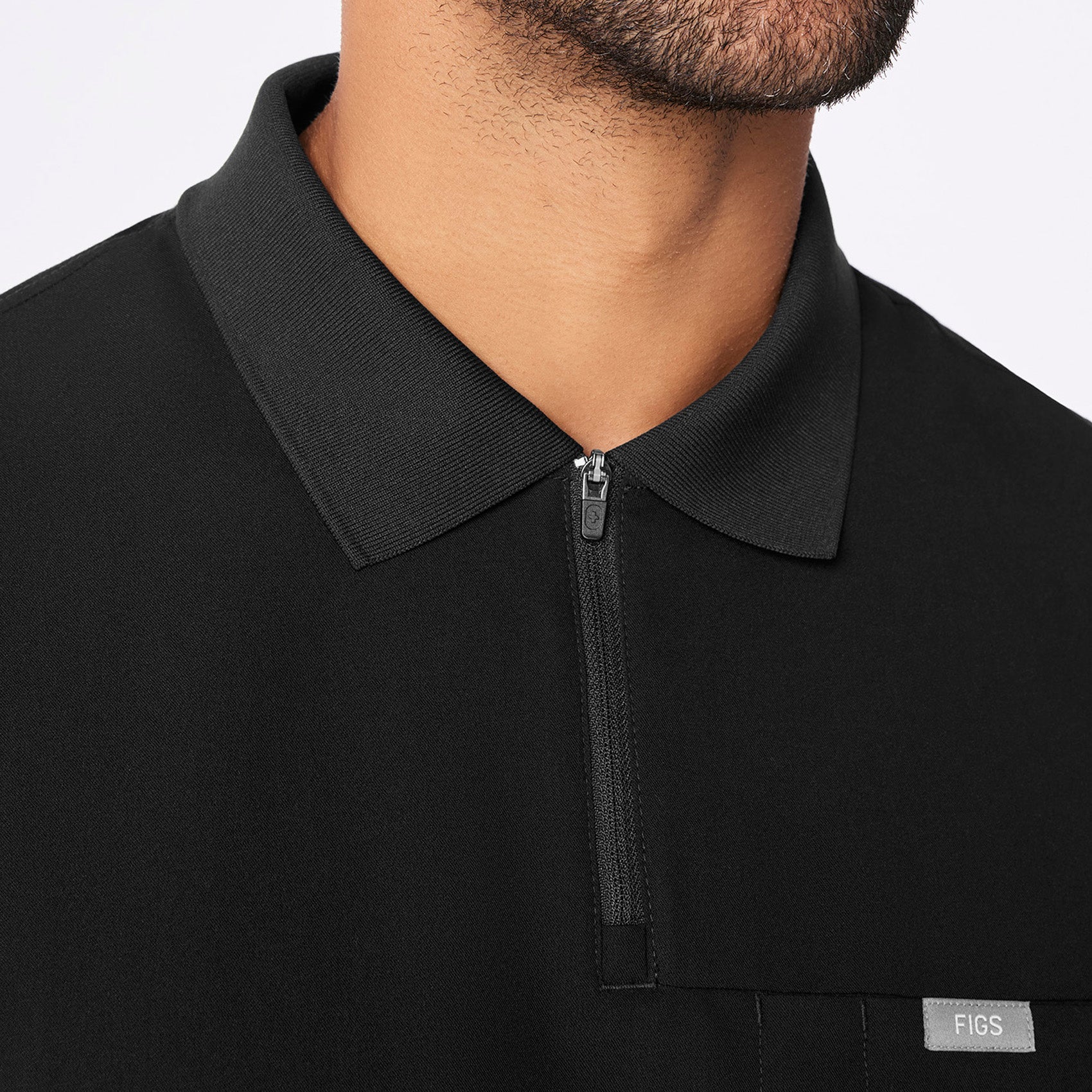 https://cdn.shopify.com/s/files/1/0139/8942/files/2025_Q4_10_BLACK_JASPER-POLO-SCRUB-TOP_GABE_1025.jpg?v=1762281336